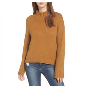 Tan fuzzy turtleneck sweater